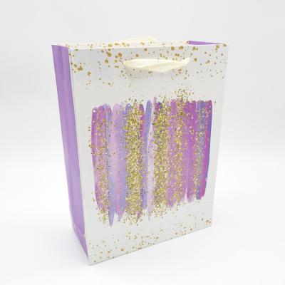 China M Wholesale Luxury Recyclable Purse Glitter Shopping Gift Packing Printed Paper Bag With Ribbon Handle for sale