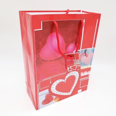 China Wholesale Recyclable Small Paper Bag Heart Print Gift Recyclable Jewelry Packaging Bag for sale