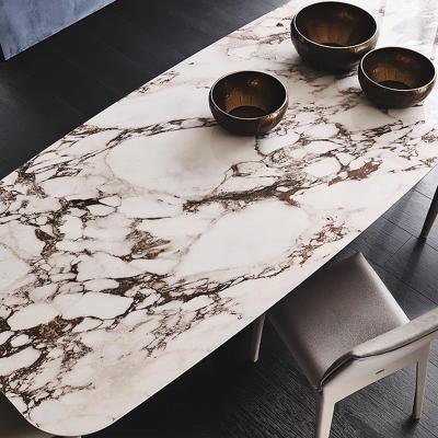 China Wear Resistance And High Hardness Modern Table Contracted Furniture Style Villa Sintered Stone Dining Tables Designs Stainless Steel Metal Marble Top Black Table for sale