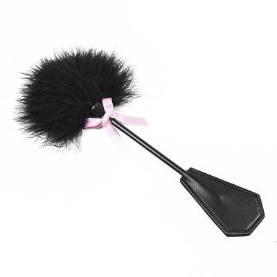 China Chicken Feather+Polyester String Sex Feather Paddle Feather Sex Toysspank Paddle for sale