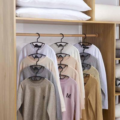 China 2022 Wardrobe Space Saving Pile Plastics Hangers For Clothes Non Slip And Traceless Modern for sale