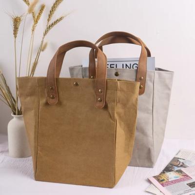 China Durable Waterproof Leather Handbag 0.55mm Thick Washable Germany Kraft Paper Handle Tote Bag Washable Paper Small With Magnetic Button for sale