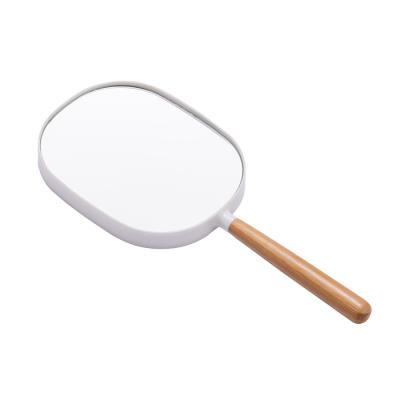 China Logo Frame Oval Elegant White Portable Plastic Wood Handle Handheld Vanity Mirror Durable Custom Made Eco-Friendly Mirror for sale