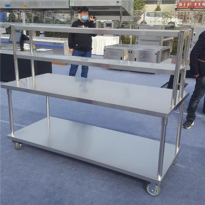 China Easily Assembled Movable Stainless Steel Restaurant Kitchen Work Table Food Prep Table With Top Shelf And Wheels for sale