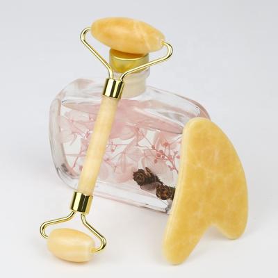 China Whitening Jade Roller Pink Melting Gua Sha Yellow Crystal Jade Roller Jade Stone For citrin massage neck and face for sale