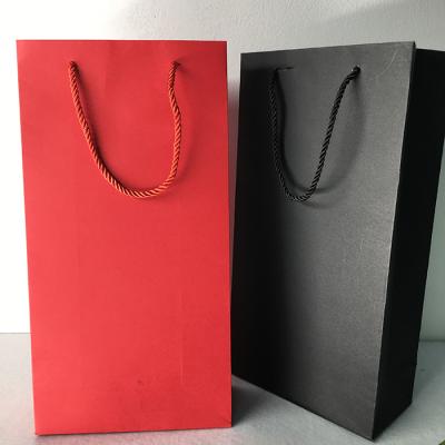 China Recyclable Custom Logo Printed Red Black Paper Gift Bags For Wine Bottles With Handle for sale