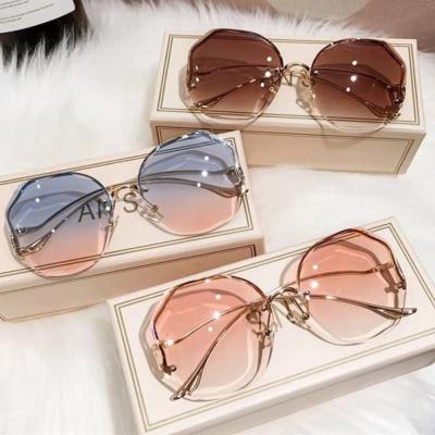 China Hot Selling Frameless Polygonal UV Ladies Glass Cut Retro Fashion Sunglasses Glasses for sale