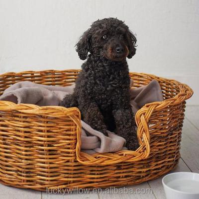 China Warm And Comfort Sustainable Oval Rattan Basket Dog Bed for sale