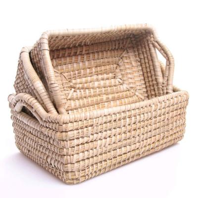 China Sustainable round grass and water cattail basket with handle for sale