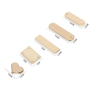 China Metal Accessories Shape Metal Logo Label Tag Bag Parts Metal Plates For Handbags for sale