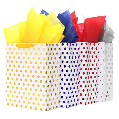 China Recyclable Solid Color Dot Pattern Retail Shopping Gift Paper Bag Kraft Paper Gift Bags With Handles for sale