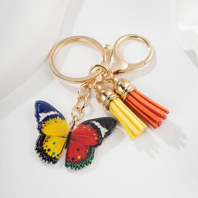 China Durable 120 Colors Suede Leather Tassel Butterfly Pendant Keychain Phone Bag Car Key Ring Charm Lady Girl Tassels Key Chain for sale