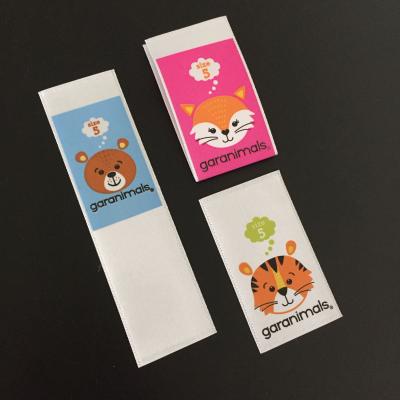 China Polyester washable custom wash satin printed logo woven apparel label for kids garment labels for sale