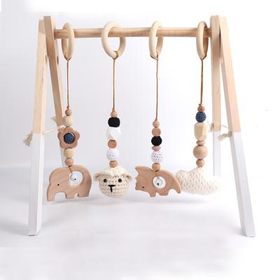 China Durable 4pcs Set Beech Wood Fitness Frame Baby Gym Toys Hanging Stroller Crochet Dolls Montessori Toys Baby Activity Toys for sale