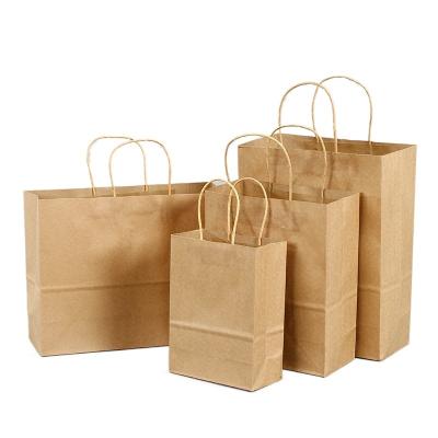 China Recyclable Brown Kraft Paper Shopping Bag Cheap Custom Printed Handbag With Handles for sale