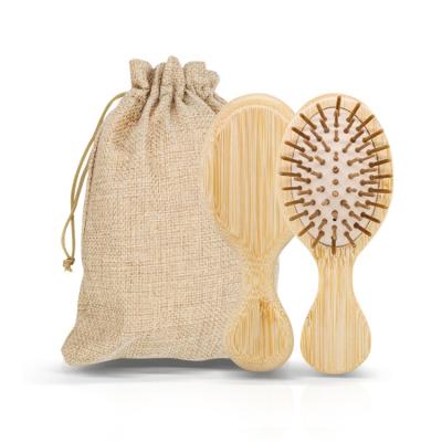 China Custom Nondisposable FSC Logo Natural Small Cushion Hair Brush with Eco-Friendly Bag Bamboo Hair Brush for sale