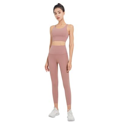 China New sports beauty sports yoga back breathable suit women's hanging breasts fast female two-piece fitness clothes bare dry yoga pants for sale