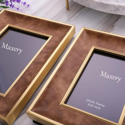 China Modern Simple Metal Photo Frame Brass And White Decor Gold Wedding Gifts For Couples Anniversary Gift for sale