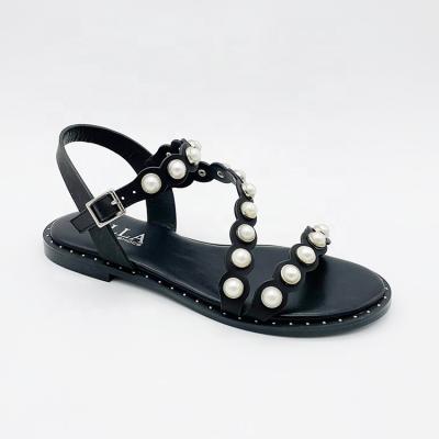 China Fashion Trend 2021 Summer Fashion Pearl Rivet Sandals Roman Strap Flat Sandals For Women Shoes for sale