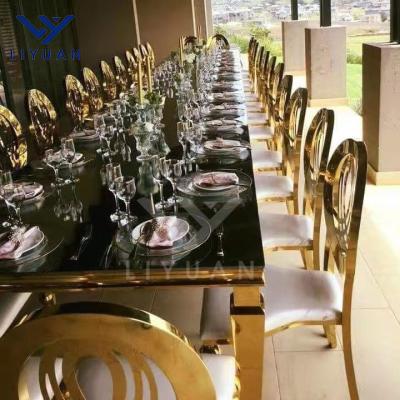 China Modern gold metal restaurant hotel LIYUAN chairs stainless steel leather round flower wedding stackable dining back chairs for sale