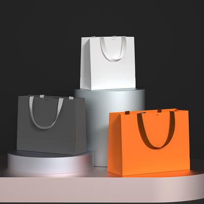 China Recycled Materials Fashion Logo Printing Color Luxury Custom Shopping Gift Bags Clothing Retail Brands Paper Bag With With Your Own Logo for sale