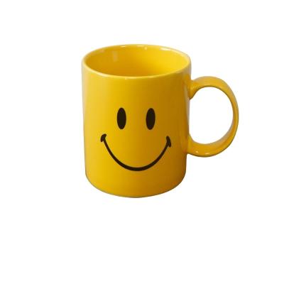 China Sustainable Smiley Coffee Cup Office Water Yellow Coffee Mug With Handle for sale