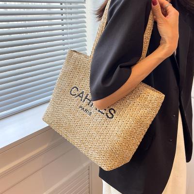 China 2022 Summer Popular Straw Woven Lady Bags Water Resistant Beach Straw Women Tote Bag With Custom Logo for sale