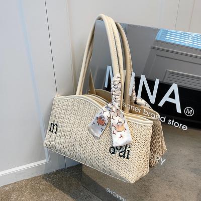 China Fashion Popular Straw Woven Bag For Women 2022 Summer Shoulder Bag Custom Logo Portable Beach Armpit Bags for sale