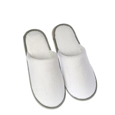 China Customized Disposable Slipper in Logo Hotel Plush Slipper Super Soft and Comfortable Durable Closed Toe Hotel Service for sale