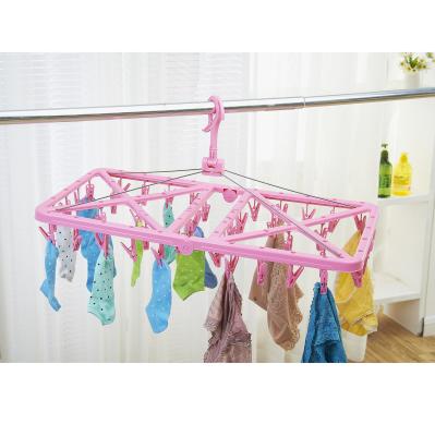 China Traditional Cheapest Plastic Clothes Hanger Anti-wind Collapsible Laundry Rack With 42 Piece Pegs for sale