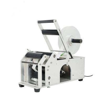 China MT-50 Semi Automatic Paper Round Sticker Bottle Food Wine Labeling Machine For Pet Bottles Boxes for sale