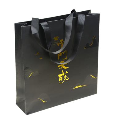 China bolsa de papel de la tela C1S de los 40cm que imprime el acabamiento ULTRAVIOLETA laminado del punto en venta