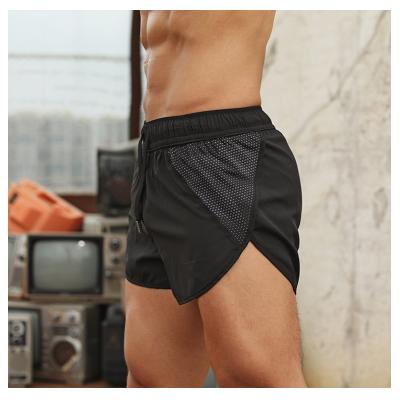 China Custom Size QUICK DRY Polyester Elastic Basketball Workout Shorts Booty Beach Jogger Basketball Running Shorts For Men for sale