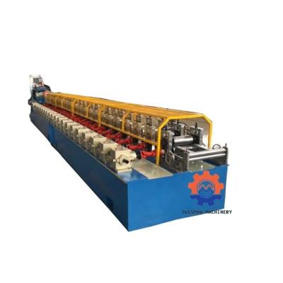 China Building Material Stores Galvanized Steel 40mm 60mm Pipe Shutter Door Octagonal 70mm Roll Forming Machine for sale