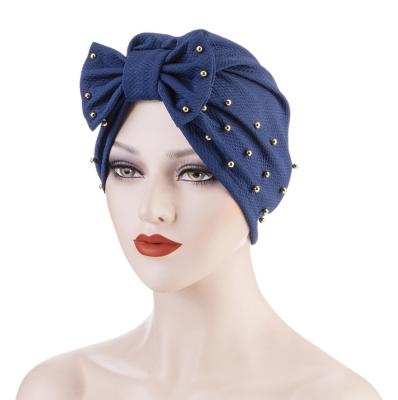 China Large Pearl Bow Multi Color Fashion Cross Women's Black Muslim Turban Hijab Hat Multi Functional Night Cap Wholesale for sale