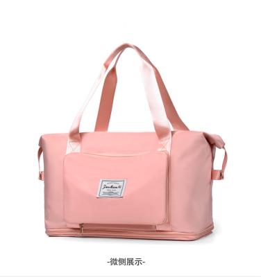 China 2022 new design fashion style luggage travel bags waterproof women traveling duffel bag ladies travel luxury pink nylon bag for sale