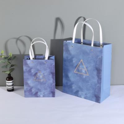 China Disposable Disposable High End Rivet Bronzing White Cardboard Texture Gift Bag Gift Shopping Tote Bag for sale