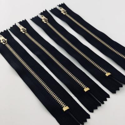 China Viable Clogged Zipper Color Metal Zipper Gold Band For Pants for sale