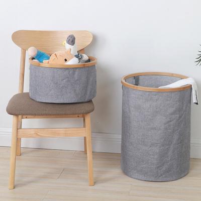 China Modern Wholesale Bamboo Rim Laundry Basket Storage Circular Folding Baskets for sale