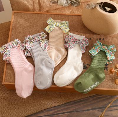 China 2021 Stock Spanish Children's Socks QUICK DRY thin bowknot floral floor stripe combed cotton baby socks stick non slip baby socks for sale