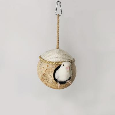 China Hot Sales Stocked Natural Coconut Shell Bird Nest Bed Parrot Hammock Bird Cage Toy for sale