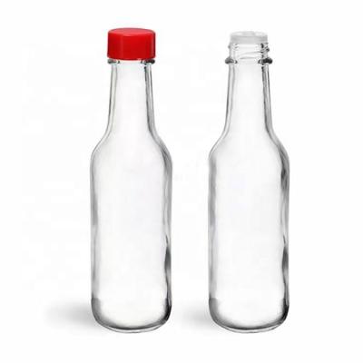 China Food factory produced clear empty packing glass dazed bottle wholesale for sale