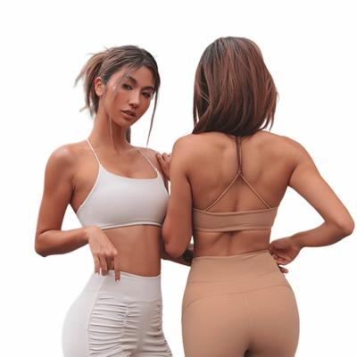 China Breathable Trend Workout Padded Tops Womens Beauty Back Yoga Gym Activewear Strappy Sports Bra for sale