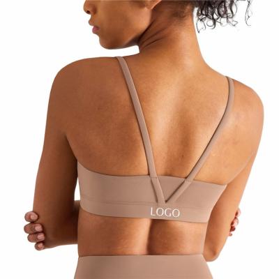 China Breathable Unique Design Hot Sale U Neck Yoga Crop Tops V-shaped Beauty Back Sujetador Deportivo Solid Color Backless Womens Sports Bras for sale