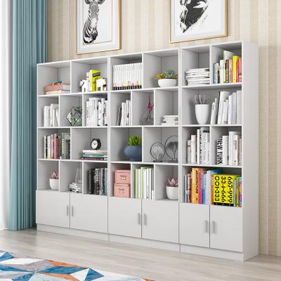 Cina Amazon hot sales modern creative height wooden bookcase chinese vertical library bookshelf with doors in vendita