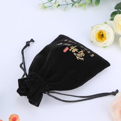 China Eco-friendly Portable Black Flocking Gold Print Velvet Pouch Jewelry Custom Drawstring Bag for sale