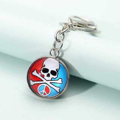 China Men's Jewelry Crystal Glass Dome Skulls Keychain Souvenir Gift Fashion Glass Ball Key Chain Glass Cabochon Keychain for sale