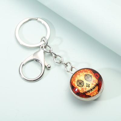 China Popular Handmade Glass Skulls Pendant Keychain Souvenir Gift Luminous Metal Glass Ball Key Chain For Men And Women for sale