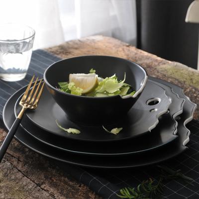 China Sustainable Wholesale Unique Shape Glazed Matte Black Ceramic Dinner Dishes For Restaurant for sale