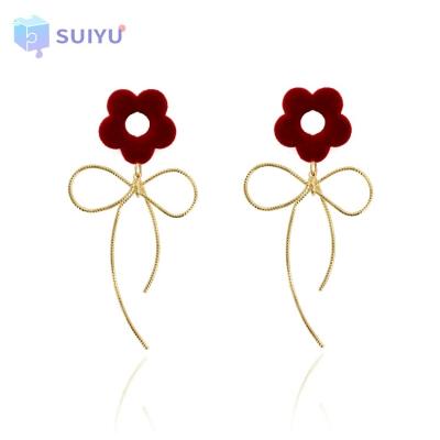 China Elegant Red Flocking Bending Earring Women Earings 2021 Flower Copper Wire Arc Statement Earings Elegant Fashion New Year Trendy for sale